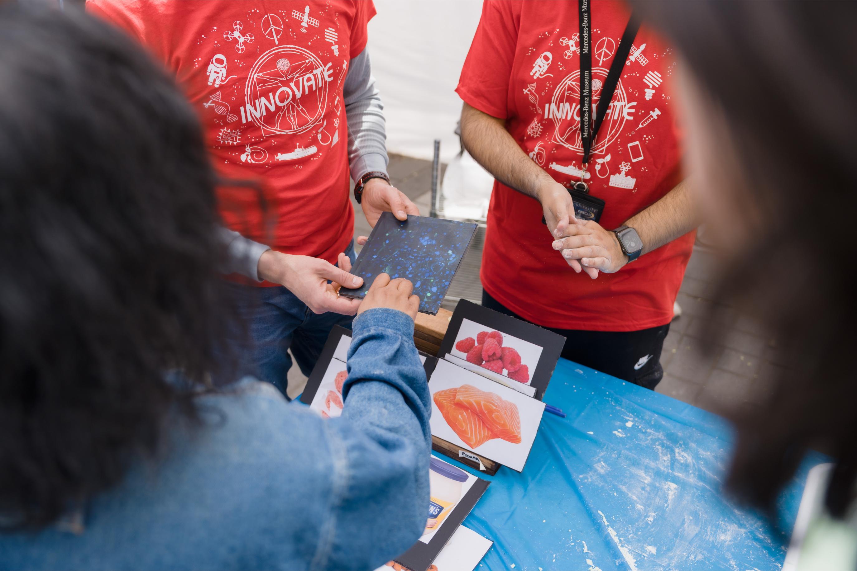 Participant engaging in an activity at the Food Science Booth.